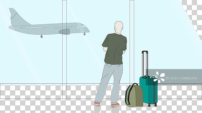 一个人在机场站着，手里提着行李图片素材