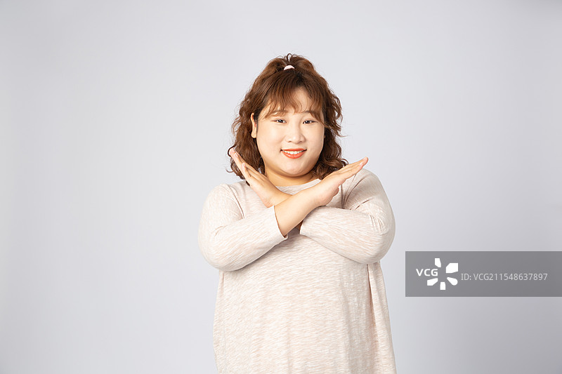 拒绝手势的亚洲肥胖女孩图片素材