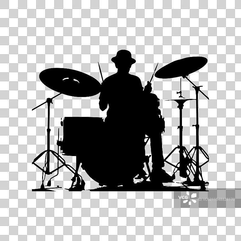 一个戴着帽子的鼓手的剪影正在演奏图片素材