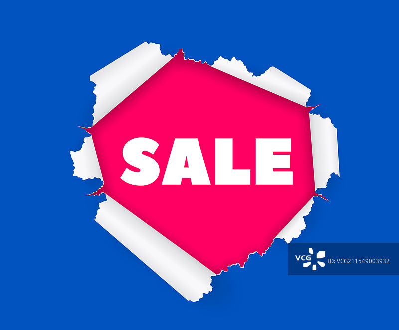 粉色纸张上的“特卖”字样透过撕裂的洞口可见图片素材