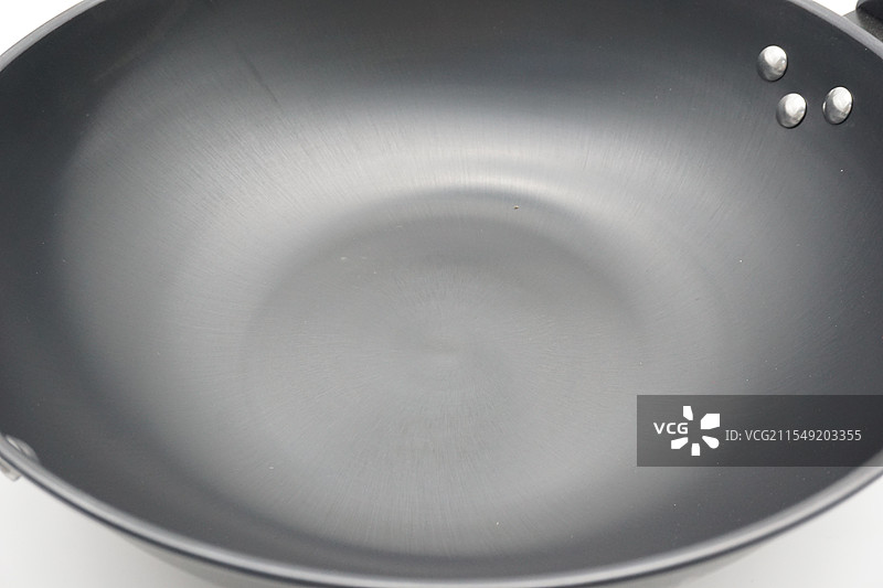家庭厨房专用的铁炒锅边缘特写图片素材