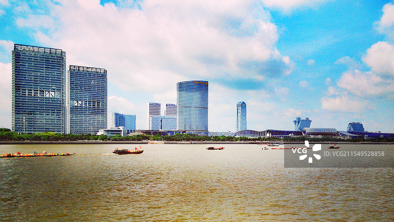 广州珠江龙舟赛端午节端阳节粽子节琶洲国际会展中心广交会展馆中国进出口商品交易展馆香格里拉酒店蓝天白云图片素材