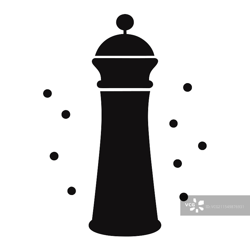 一个时尚的胡椒磨周围环绕着整颗黑胡椒。图片素材