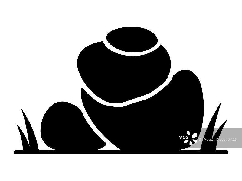 风格化的石头静静地躺在草地上图片素材