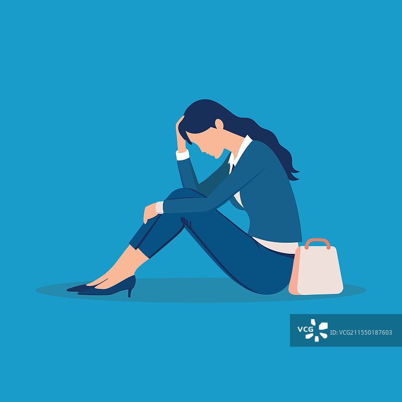 一个烦恼的年轻女商人坐在地上图片素材