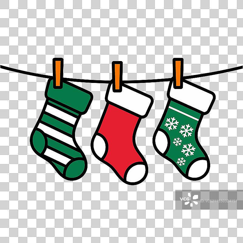 五彩缤纷的圣诞袜挂在墙上图片素材