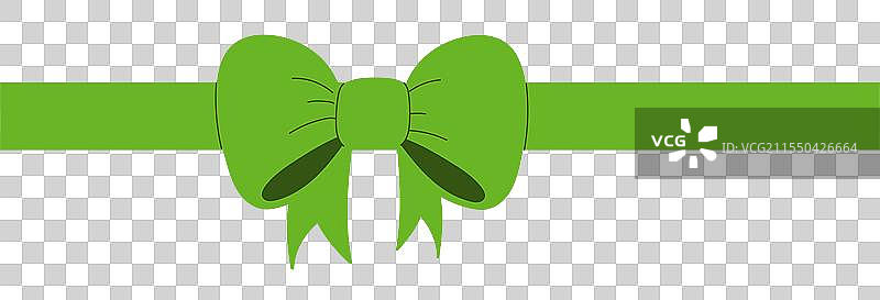 绿色丝带打成的蝴蝶结放置在一旁图片素材