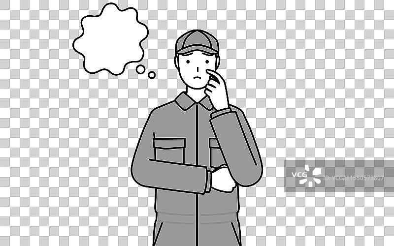 一名穿着工作服的机械师在思考时抓挠头部图片素材