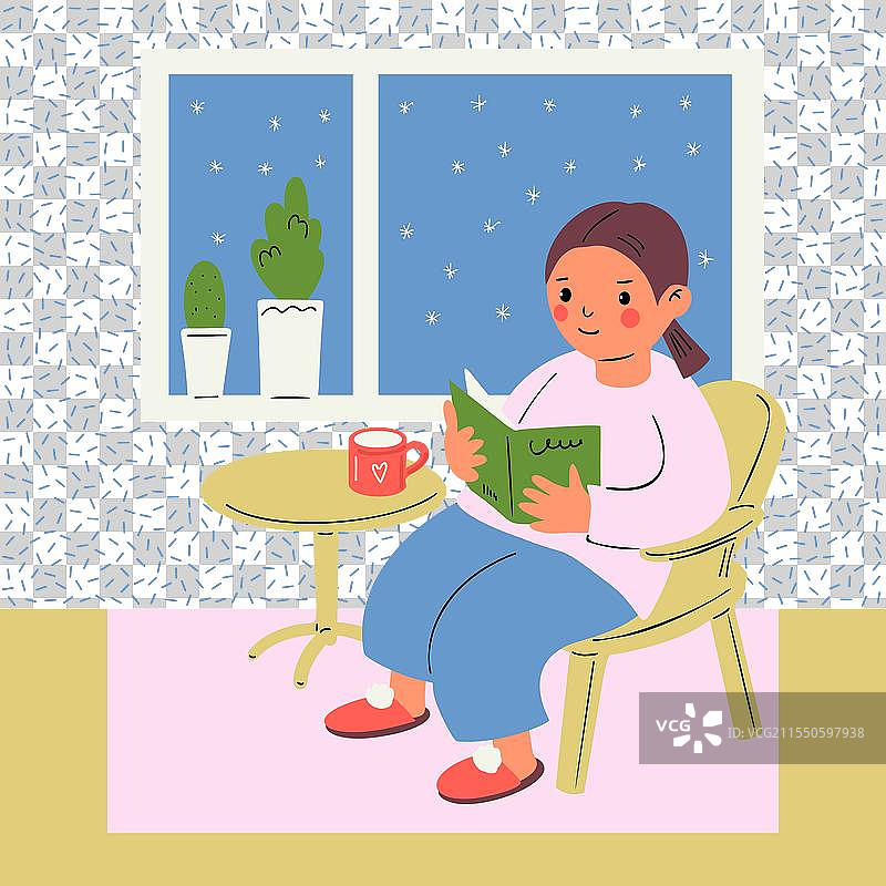 一个女孩在她的房间里阅读一本书，正在画画。图片素材