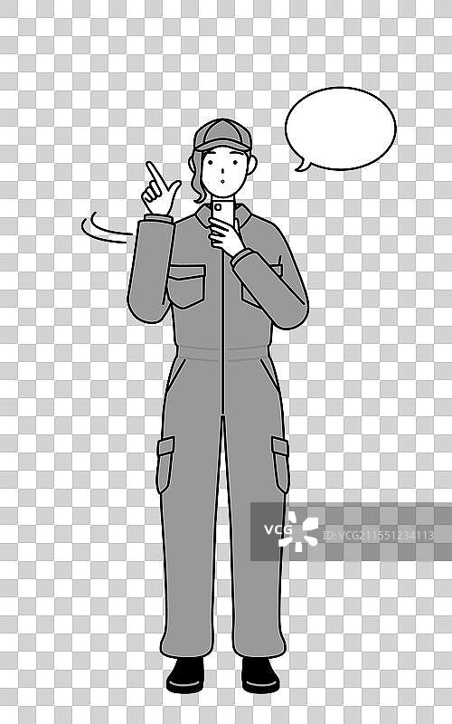 穿着工作服的女性机械师正在操作一台设备图片素材