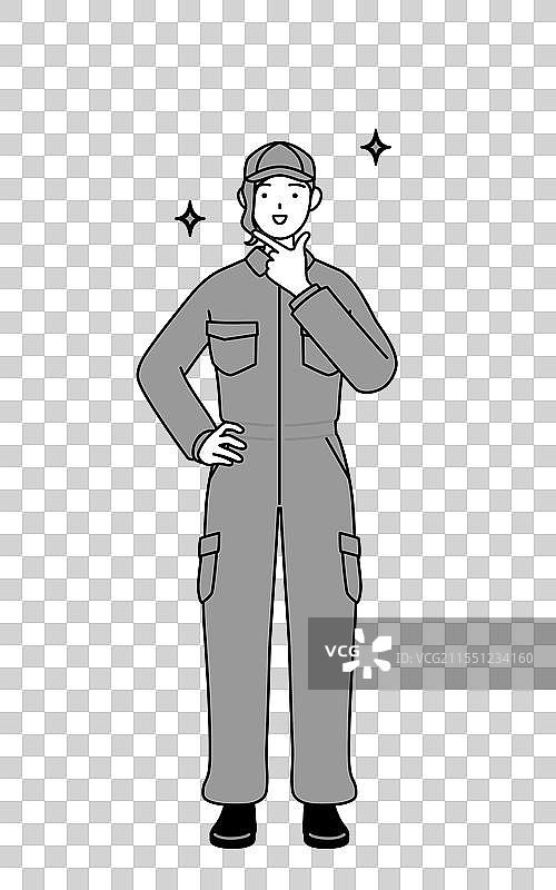 一位穿着工作服的女性机械师自信地摆姿势图片素材