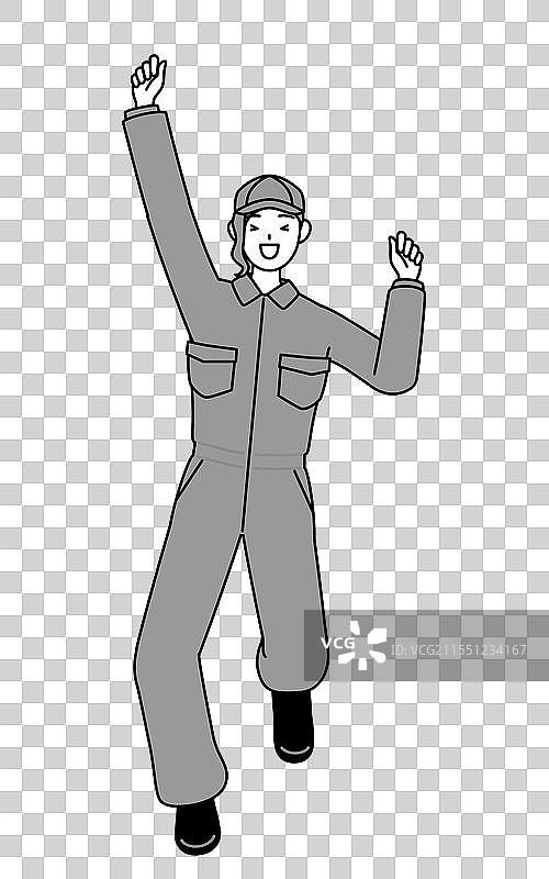穿着工作服的女机械师在跳跃图片素材