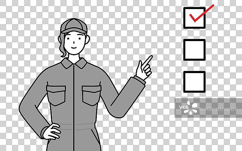 一位穿着工作服的女性机械师指着一个图片素材