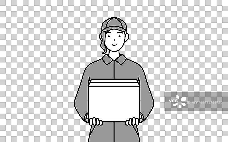 一位穿着工作服的女机械师正在努力搬运物品图片素材