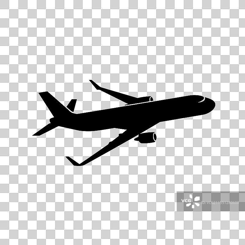 飞机在日落时分飞越城市天际线图片素材