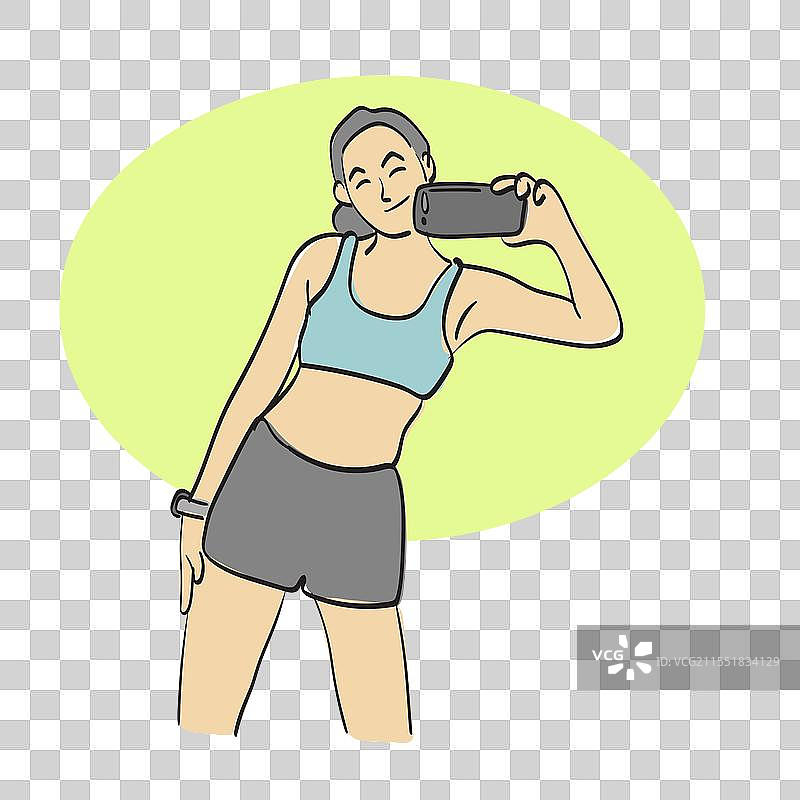 女性在健身房用智能手机自拍图片素材