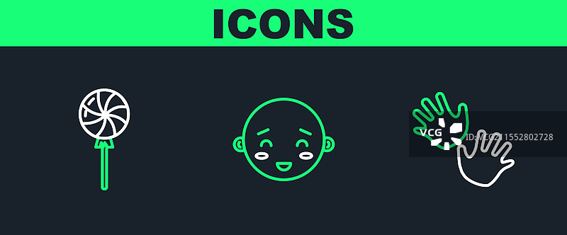 婴儿手印、棒棒糖和快乐的组合图片素材