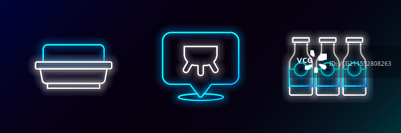 在黄油盘中放置装有牛奶黄油的瓶子。图片素材