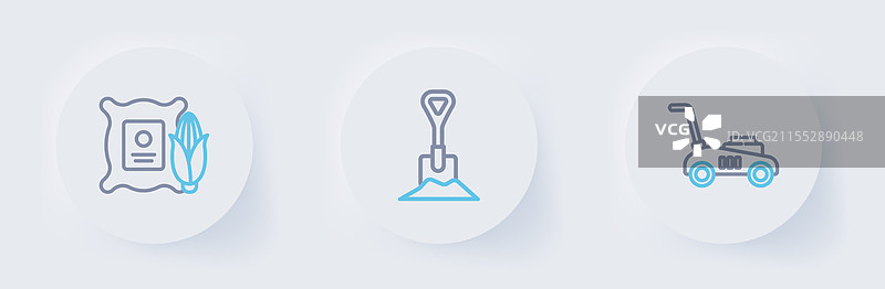 割草机、铲子插入土壤和玉米图片素材