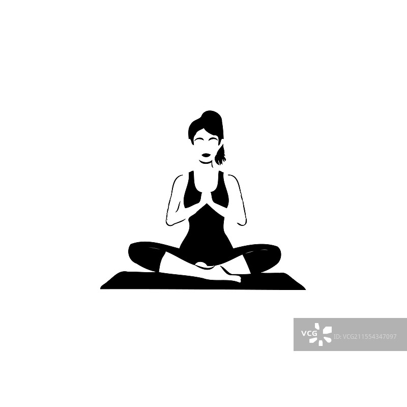 黑白色的女子在瑜伽垫上做瑜伽姿势图片素材