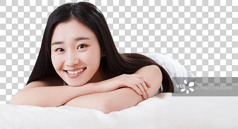 青年女人在卧室的床上图片素材