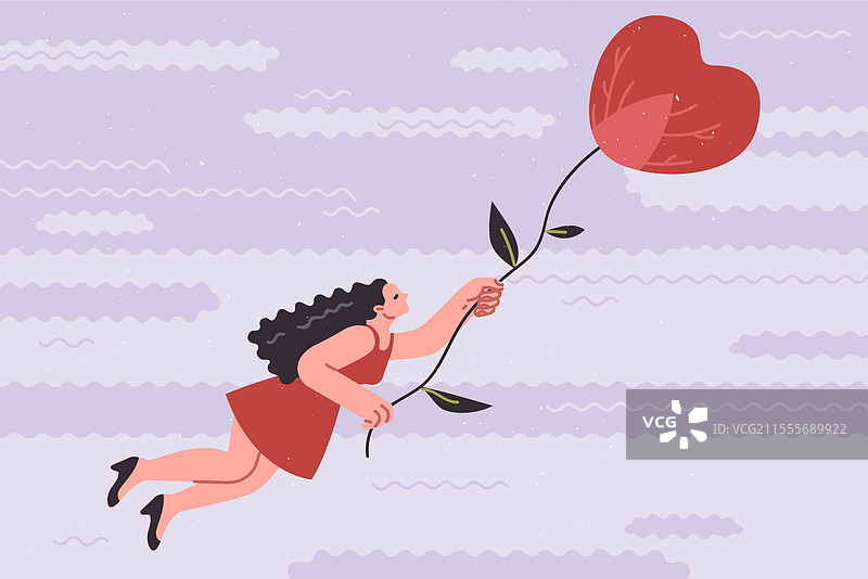 女人在心形热气球中飞翔图片素材