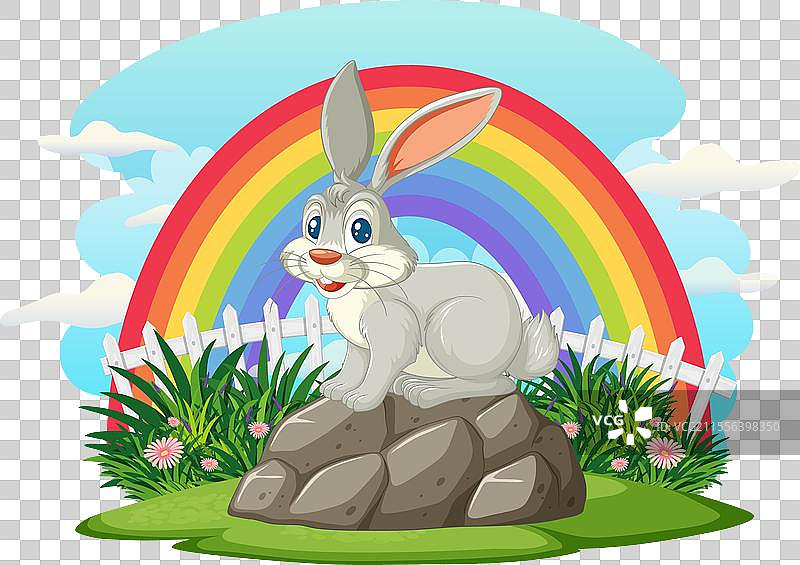 卡通兔子在岩石上，彩虹下方。图片素材