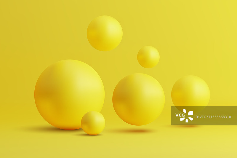 明亮黄色背景上的黄色球体排列图片素材
