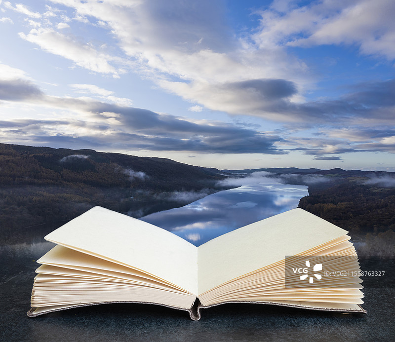 令人惊叹的航拍风景图，展现了日出时分美丽的秋季晨景，图像从一本书的页面中浮现出来。图片素材