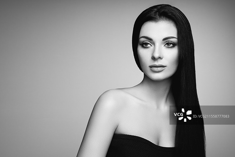 美丽的长发女性。化妆和发型完美的女孩。健康的深色头发模特。时尚照片。图片素材
