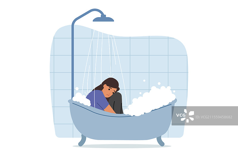 沮丧的女人穿着衣服坐在浴缸里图片素材