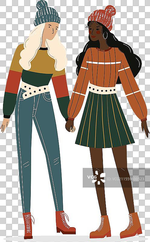 两个女人手牵手，一个金发，一个黑发。图片素材