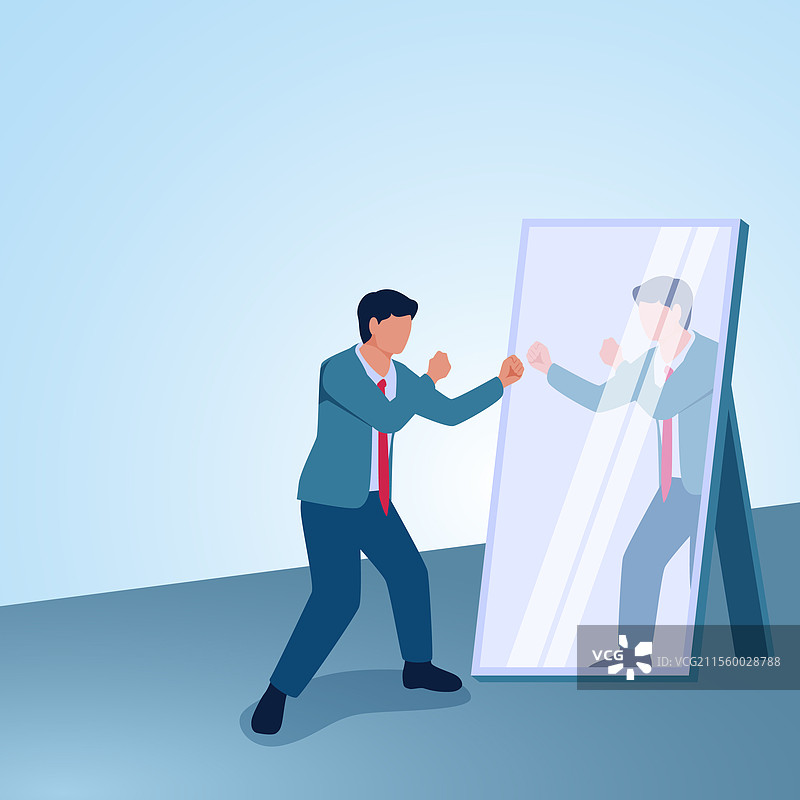 一个面对镜子的男人做出拳击手势图片素材