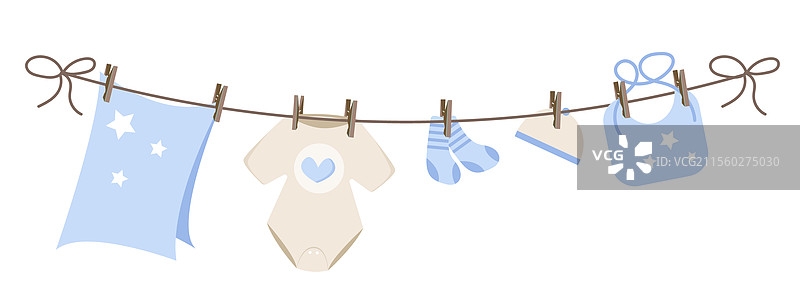 婴儿衣物挂在晾衣绳上图片素材