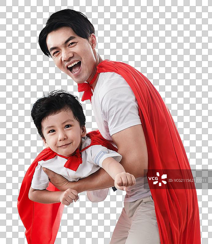 快乐的父子在扮演超人图片素材