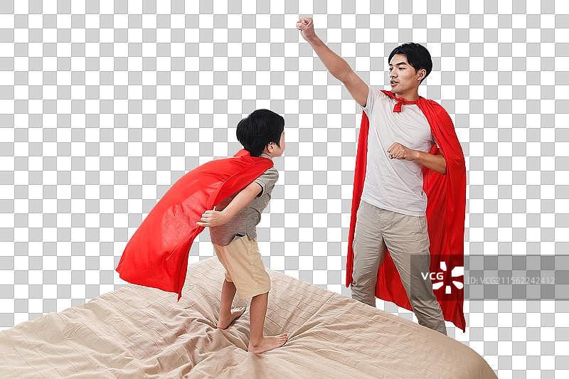 快乐的父子在扮演超人图片素材