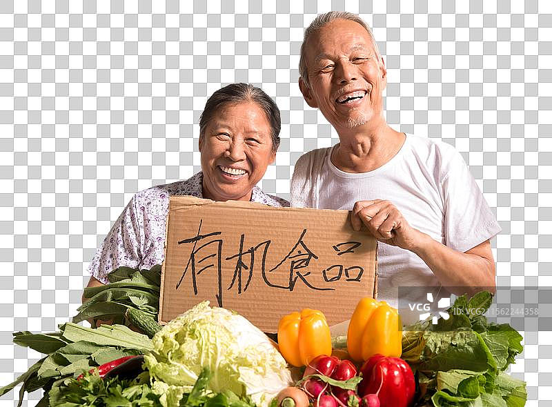 农民夫妇出示自家蔬菜图片素材