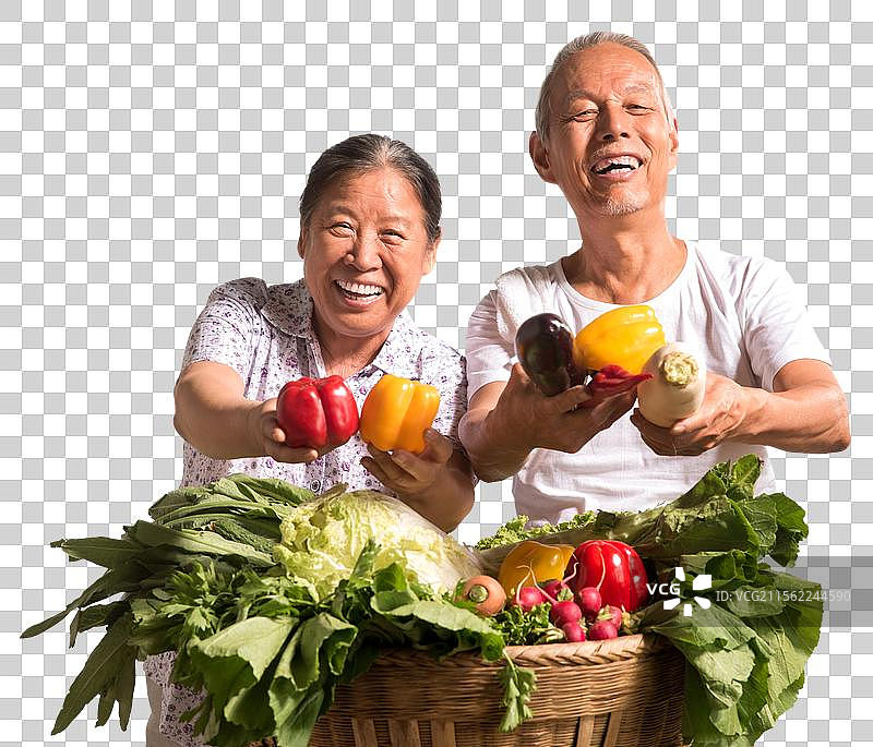 农民夫妇出示自家蔬菜图片素材