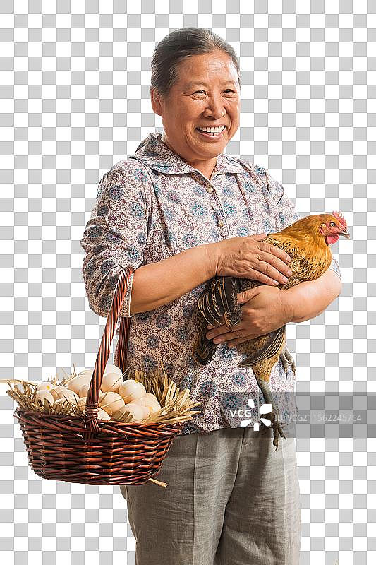 农民拿着鸡和鸡蛋图片素材