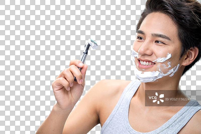 帅气的年轻男人刮胡子图片素材