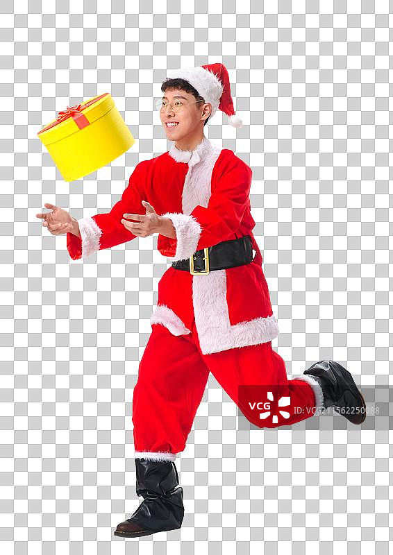 快乐的圣诞老人拿着礼物图片素材