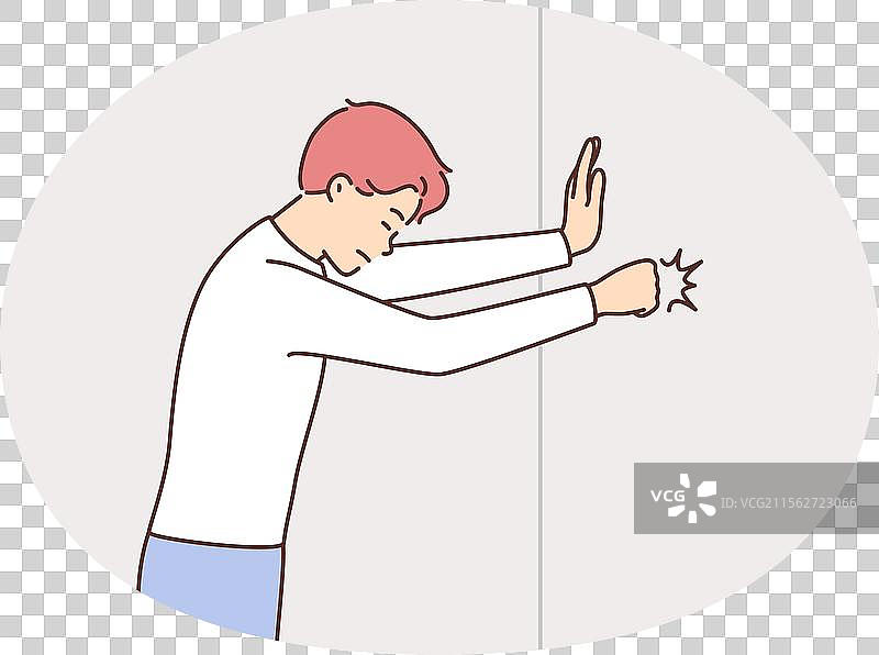 愤怒的男人用拳头击打墙壁图片素材