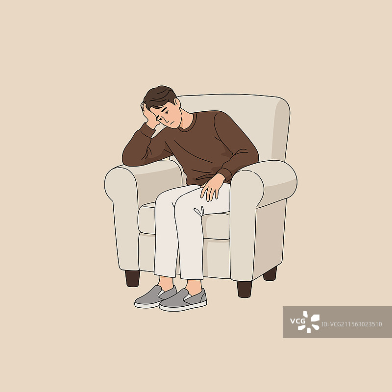 坐在扶手椅上的男人感到沮丧和悲伤图片素材