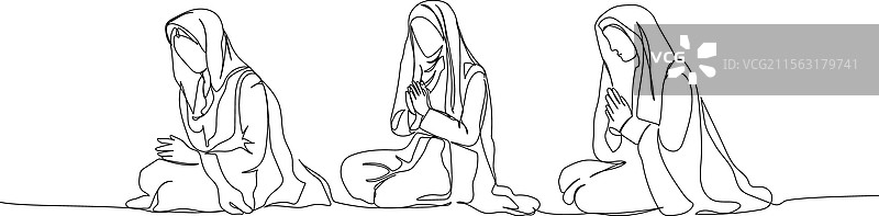 一组阿拉伯女性跪着祈祷的场景图片素材