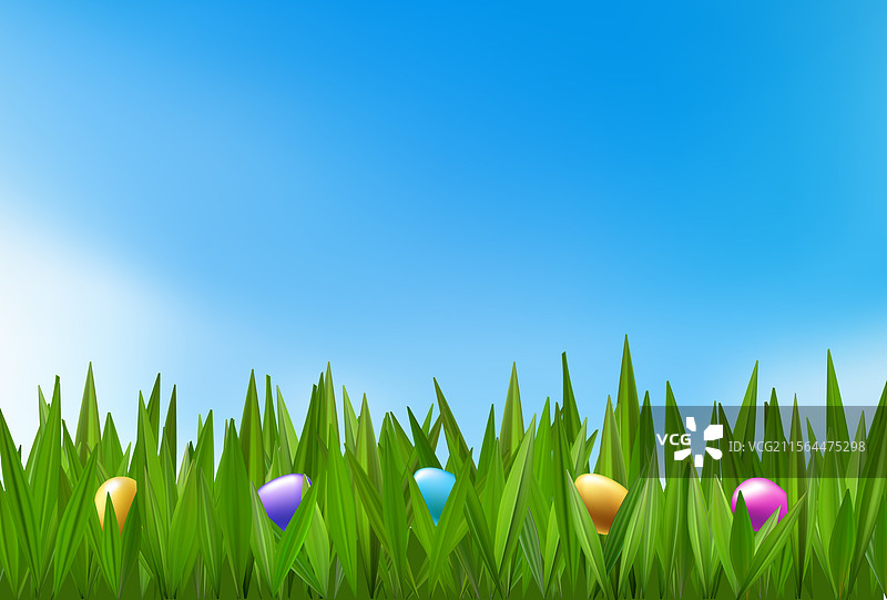 复活节彩色巧克力蛋在绿色草地上图片素材