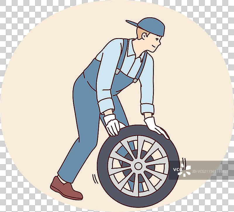 男子汽车修理工更换汽车轮胎为新轮胎图片素材