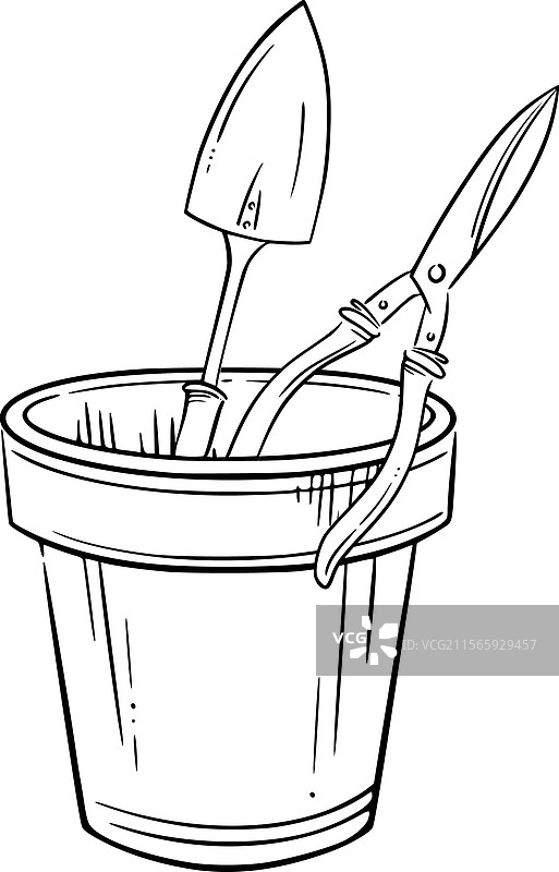 花盆里放着一个小铲子和修剪剪刀图片素材