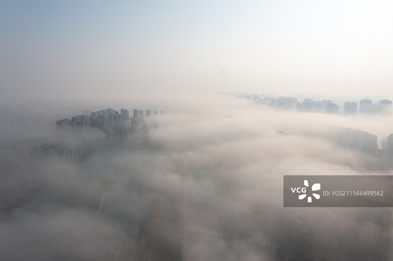 航拍晨雾中的宁夏银川城市天际线摩天大楼图片素材