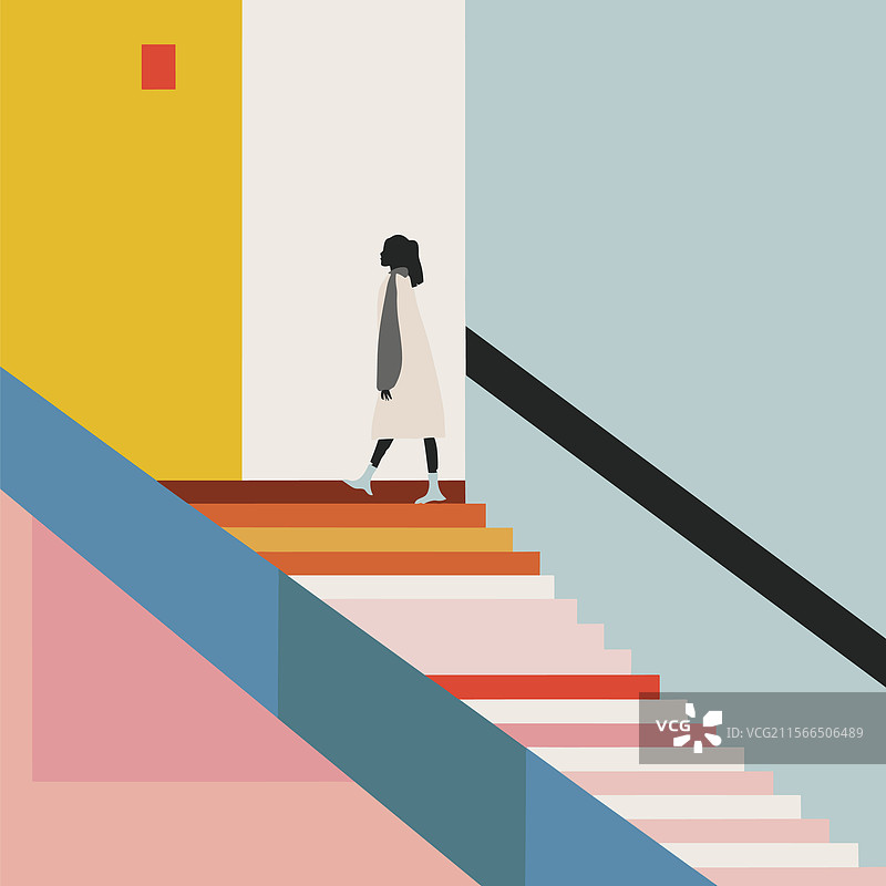 年轻女性在室内攀爬五彩斑斓的楼梯图片素材