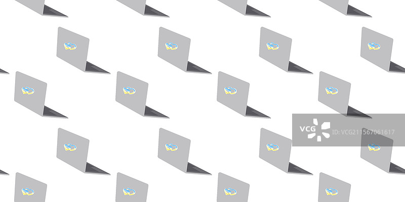 笔记本电脑盖上的心形贴纸，采用乌克兰国旗颜色。图片素材